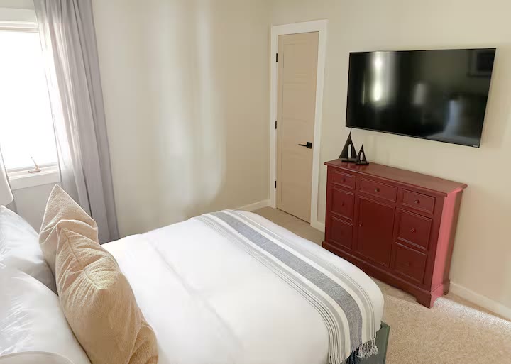 Weiss Lake House with Private Dock primary bedroom at a direct-booking vacation rental in Cedar Bluff, Alabama