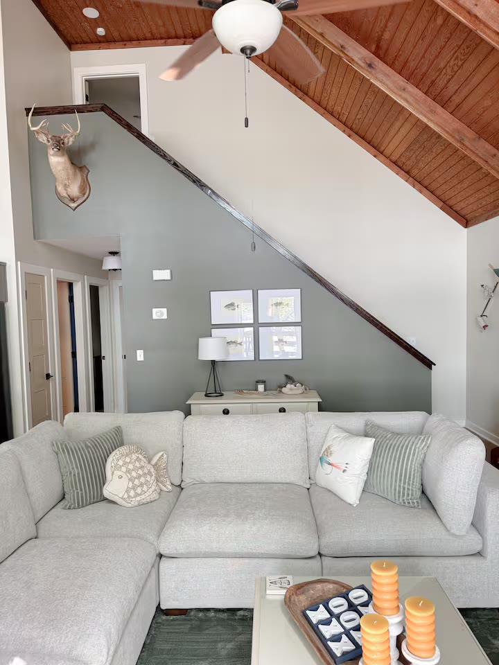 Weiss Lake House with Private Dock living room fireplace at a direct-booking vacation rental in Cedar Bluff, Alabama
