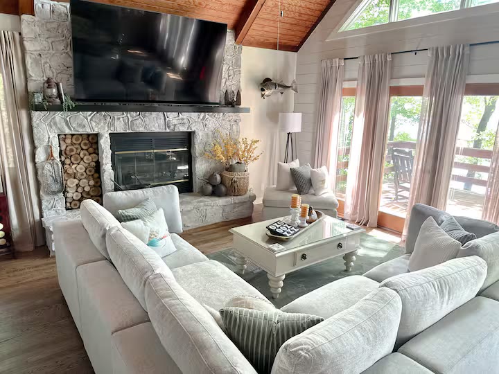 Weiss Lake House with Private Dock living room windows at a direct-booking vacation rental in Cedar Bluff, Alabama