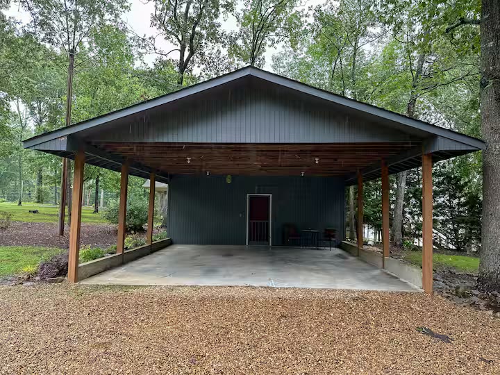 Weiss Lake House with Private Dock cabin exterior side view at a direct-booking vacation rental in Cedar Bluff, Alabama