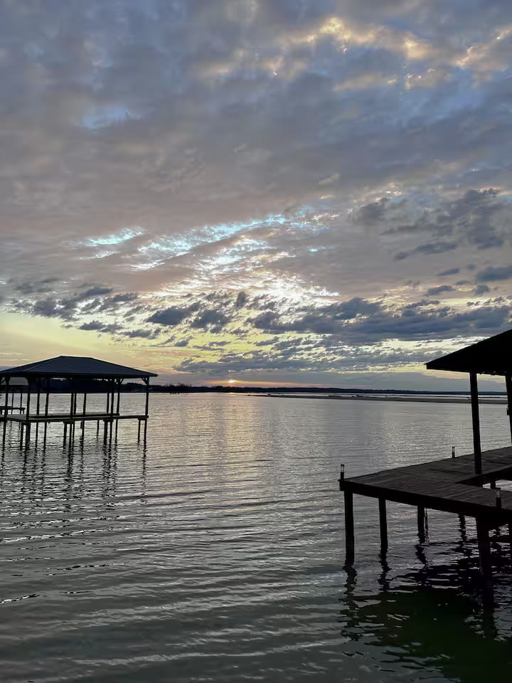 Weiss Lake House with Private Dock lakefront seating at a direct-booking vacation rental in Cedar Bluff, Alabama