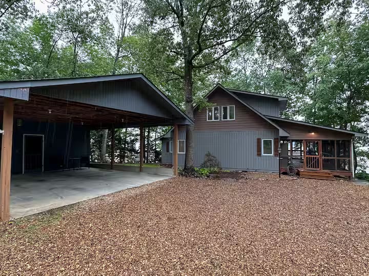 Weiss Lake House with Private Dock covered carport at a direct-booking vacation rental in Cedar Bluff, Alabama